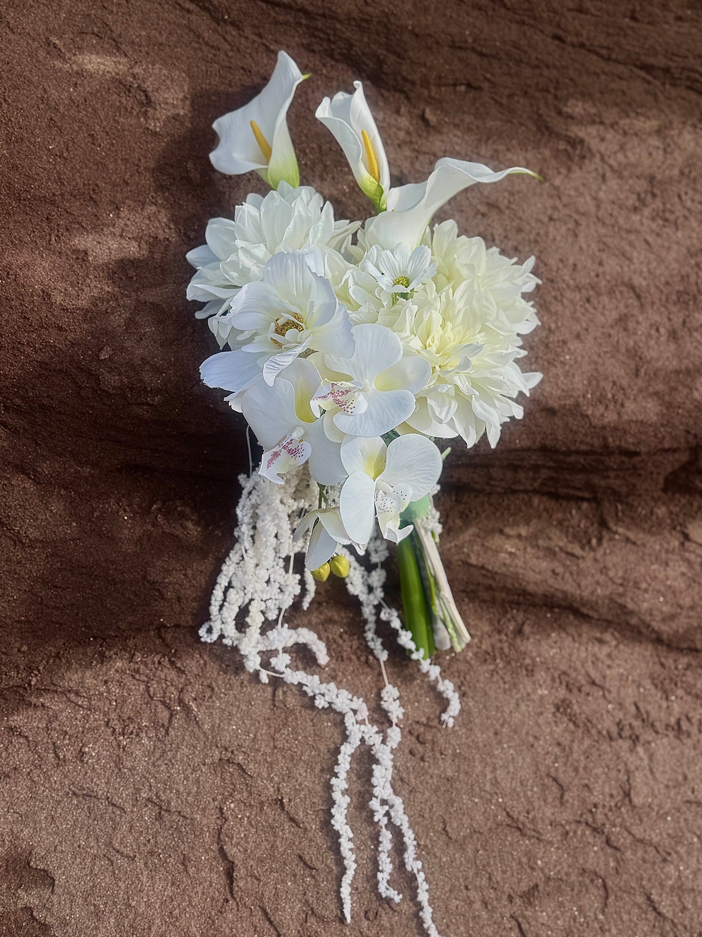 White hydrangeas, dahlias, hanging amaranthus and orchid modern wedding