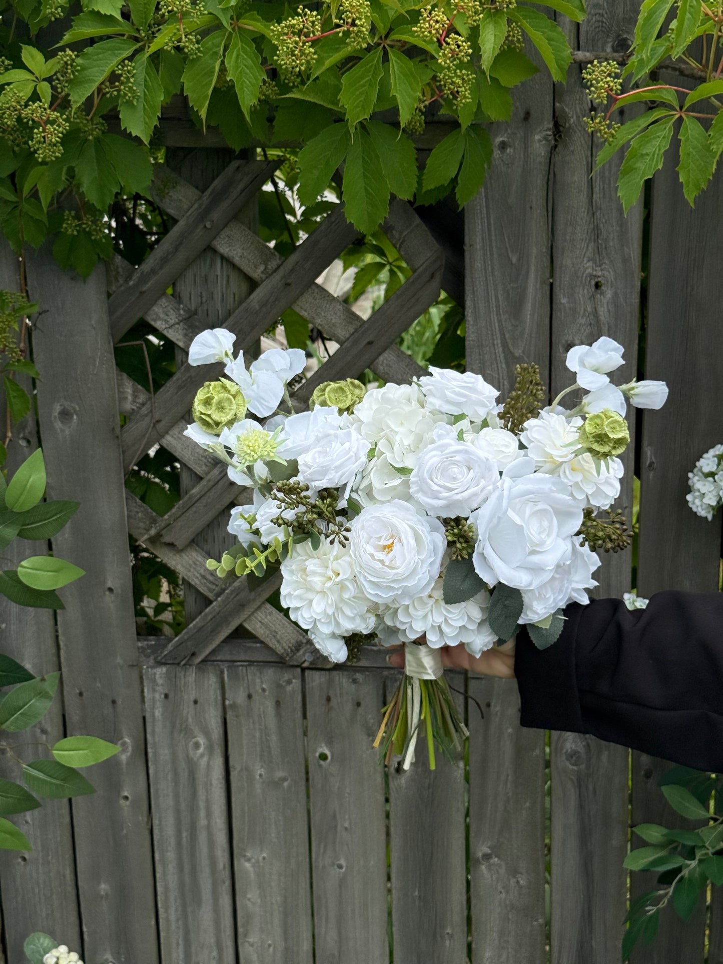 Garden white classic bridal bouquet with dahlias, roses, eucalyptus, berries