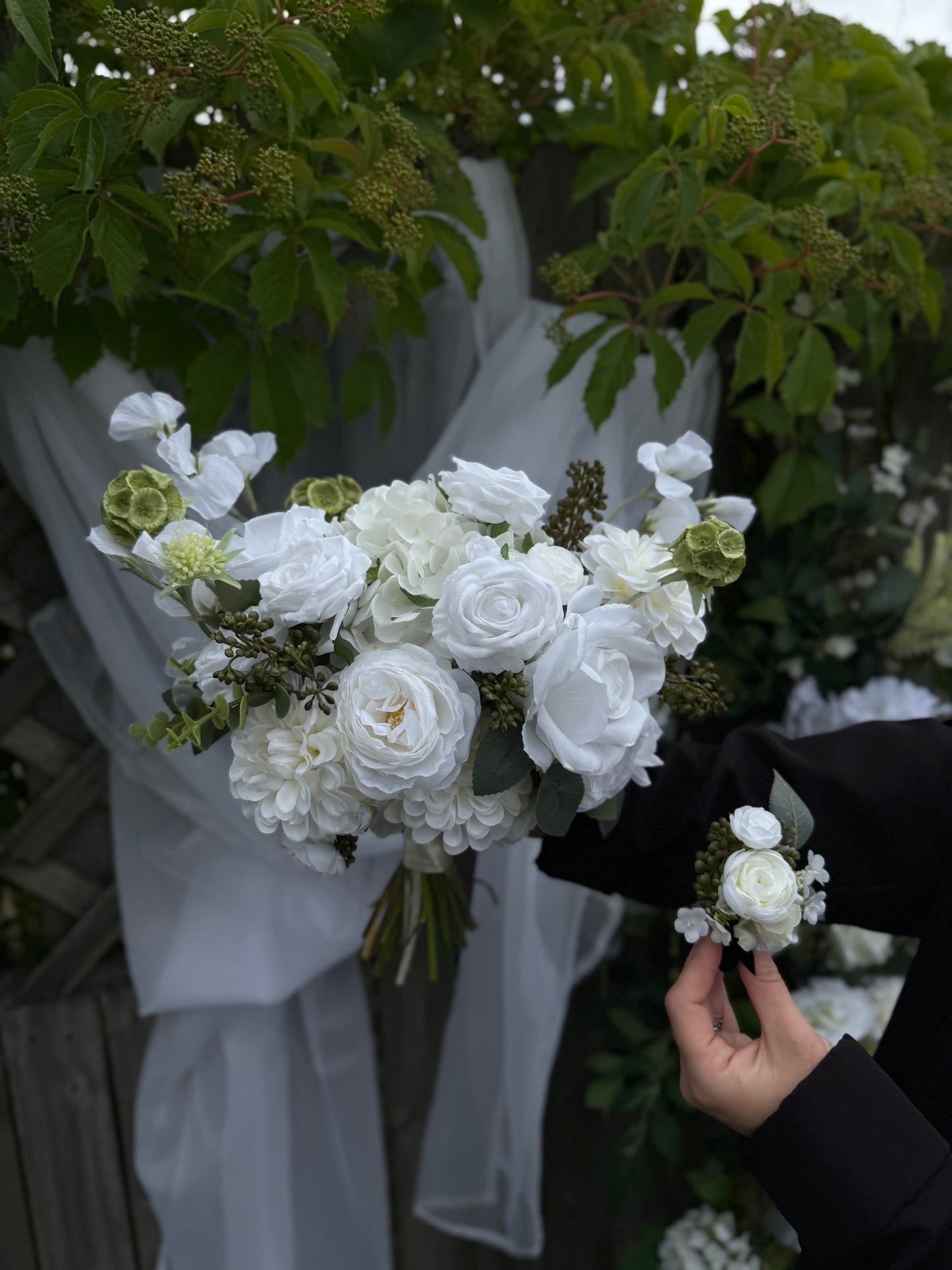 Garden white classic bridal bouquet with dahlias, roses, eucalyptus and berries 