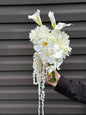 White hydrangeas, dahlias, hanging amaranthus and orchid modern wedding 