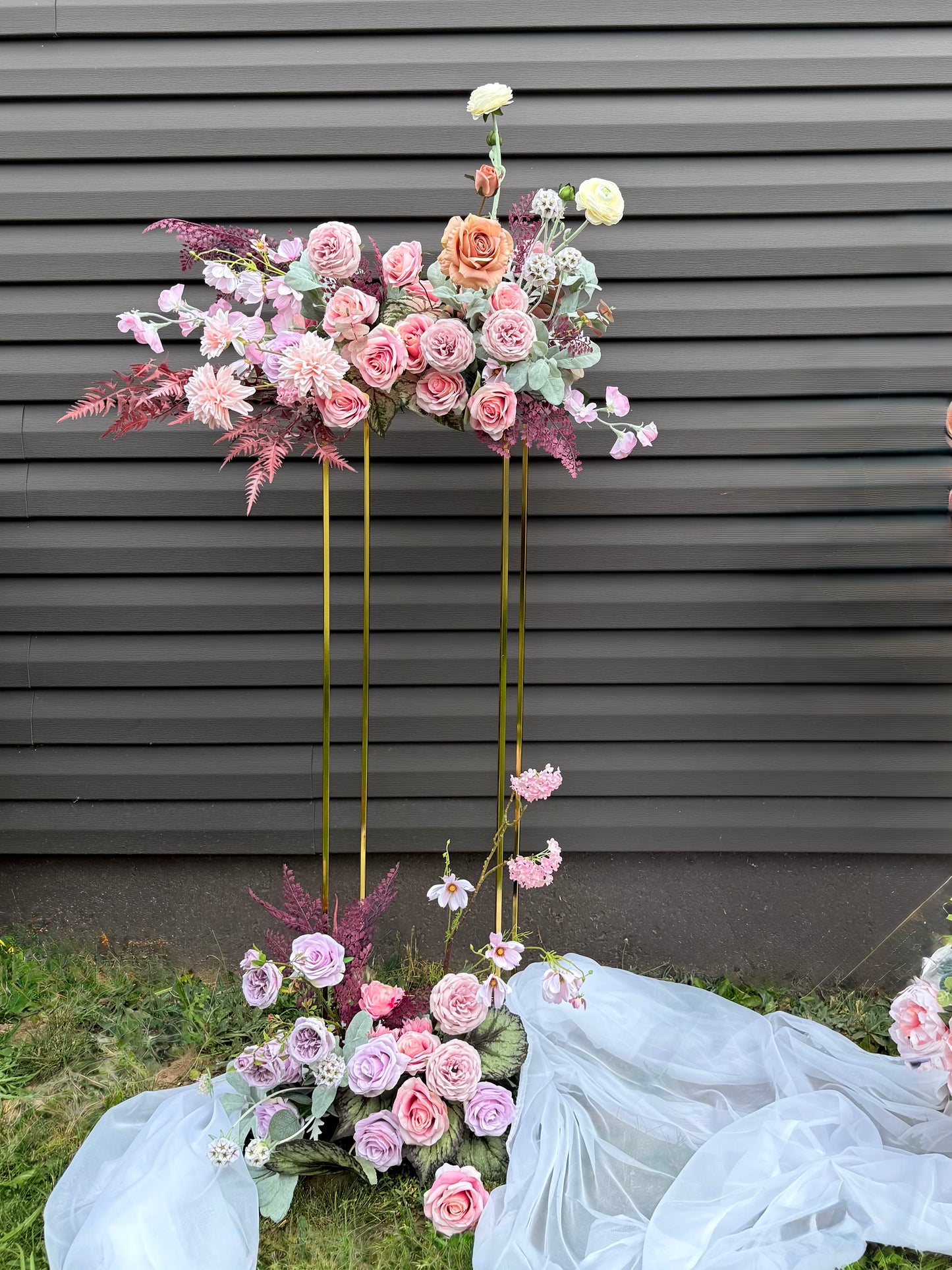 Golden stand with bright pastel floral decor