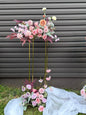 Golden stand with bright pastel floral decor
