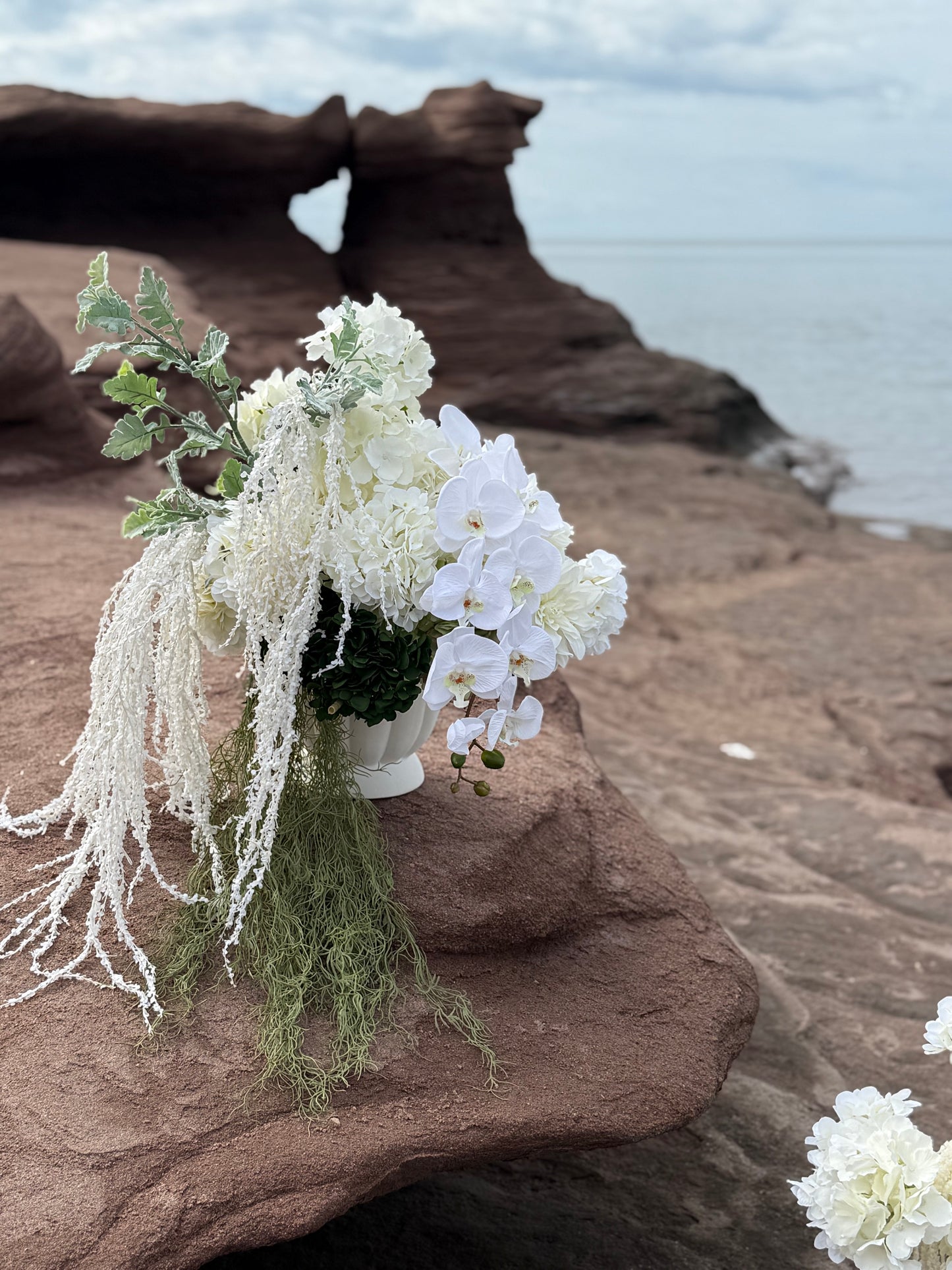 White hydrangeas, dahlias, hanging amaranthus and orchid modern wedding 