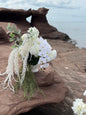 White hydrangeas, dahlias, hanging amaranthus and orchid modern wedding 