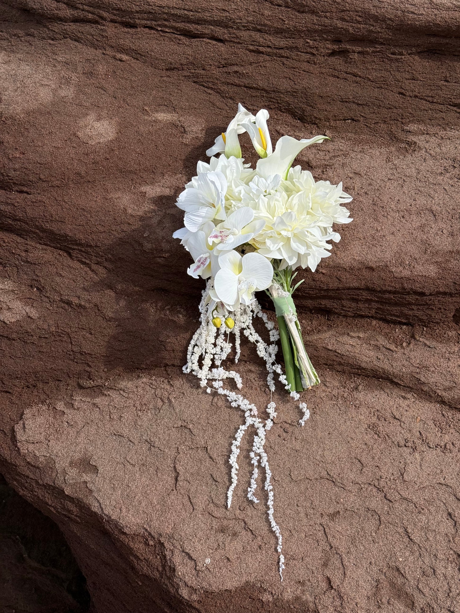 White hydrangeas, dahlias, hanging amaranthus and orchid modern wedding 