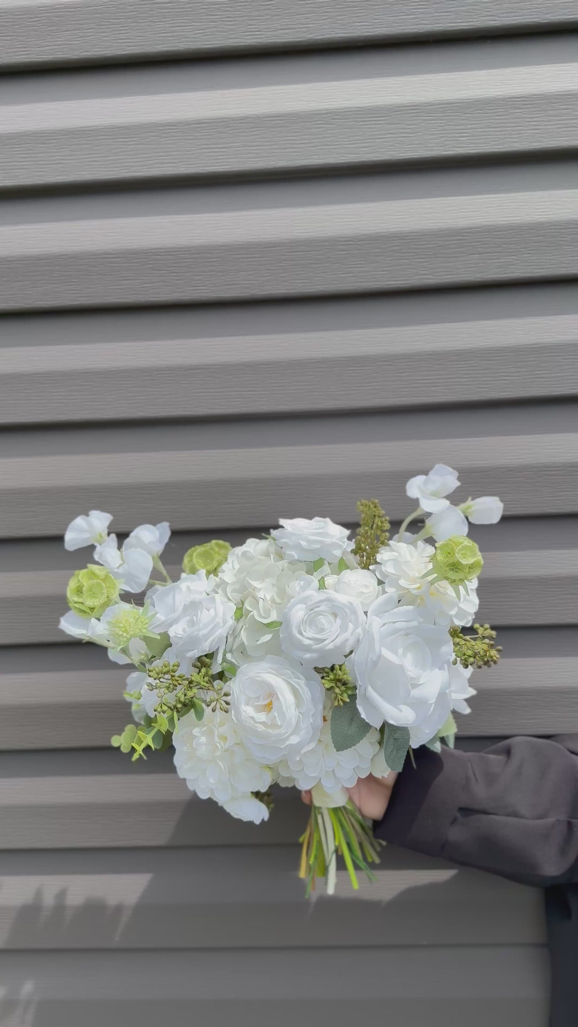Classic modern faux white bridal bouquet with roses, dahlias, hydrangeas, scabiosa balls and berries 