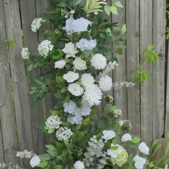 Garden white classic broken arch with dahlias, roses, eucalyptus and brunches 