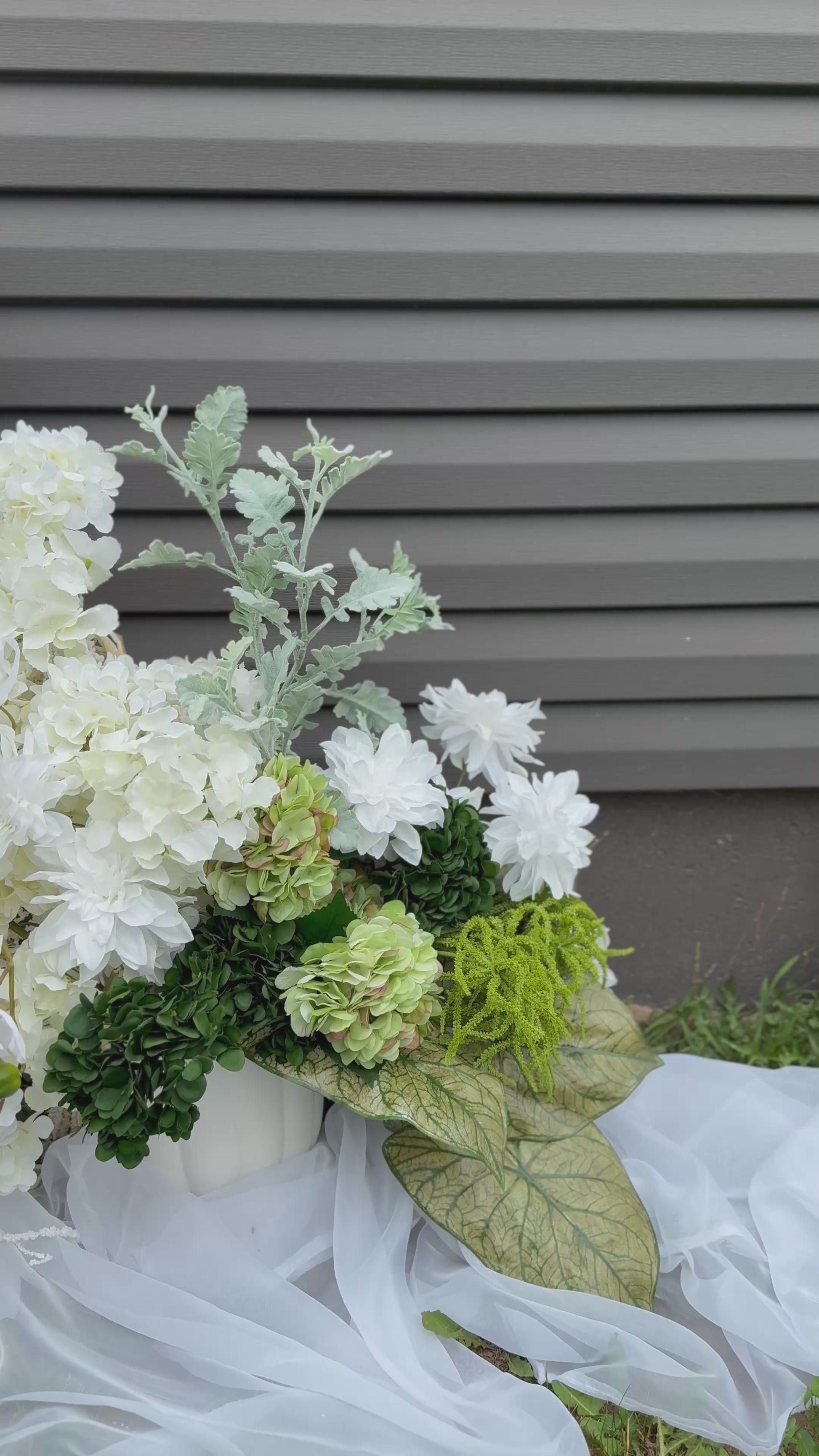 White hydrangeas, dahlias, hanging amaranthus and orchid modern wedding floral decor 